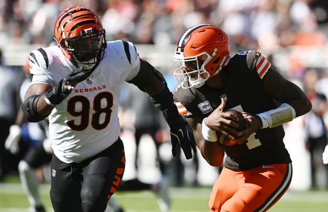 Oct 20, 2024; Cleveland, Ohio, USA; Cleveland Browns quarterback Deshaun Watson (4) runs from Cincinnati Bengals defensive tackle Sheldon Rankins (98) during the first half at Huntington Bank Field. Mandatory Credit: Ken Blaze-Imagn Images/File Photo