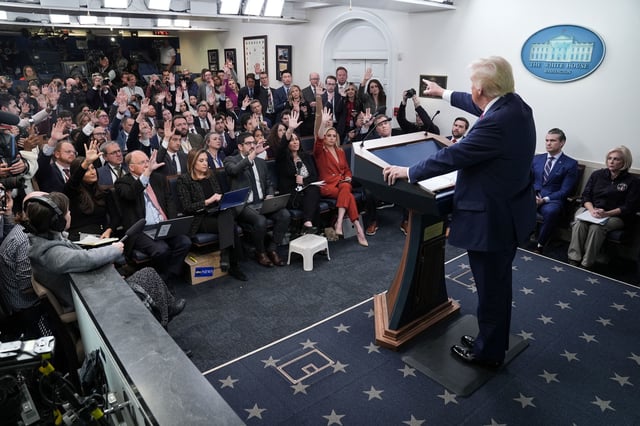 President Donald Trump takes questions from reporters during a briefing in the White House.