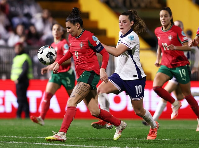 Soccer Football - Women's Nations League - League A - Portugal v England - Portimao Estadio, Portimao, Portugal - February 21, 2025 Portugal's Ana Borges in action with England's Ella Toone REUTERS/Rodrigo Antunes