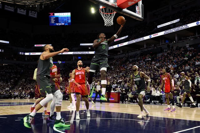 Anthony Edwards #5 of the Minnesota Timberwolves goes up for a layup against the Houston Rockets in the third quarter at Target Center on February 06, 2025 in Minneapolis, Minnesota.