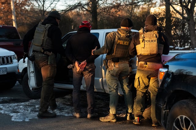 U.S. Immigration and Customs Enforcement (ICE) agents apprehend an undocumented migrant they were surveilling in Herndon, Va. on Jan. 15, 2025.