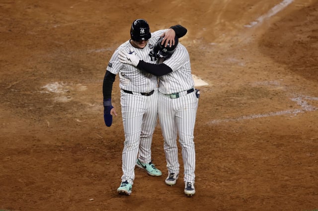NEW YORK, NEW YORK - OCTOBER 28: Alex Verdugo #24 of the New York Yankees celebrates his two-run home run with teammate Anthony Rizzo #48 in the ninth inning against the Los Angeles Dodgers during Game Three of the 2024 World Series at Yankee Stadium on October 28, 2024 in the Bronx borough of New York City.