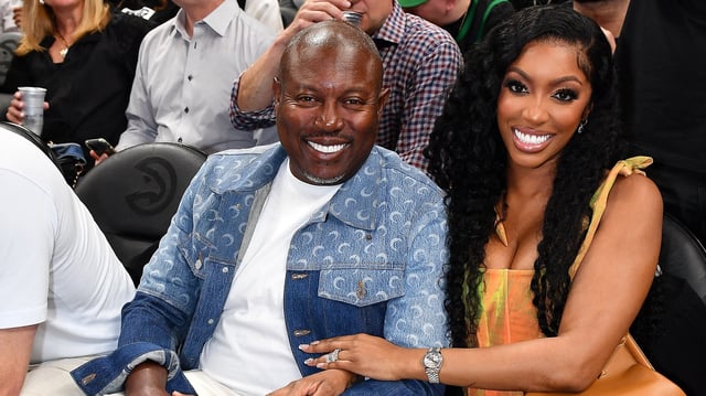 Simon Guobadia and Porsha Williams attend Game Three of the Eastern Conference First Round Playoffs between the Boston Celtics and the Atlanta Hawks at State Farm Arena on April 21, 2023 in Atlanta, Georgia.