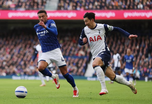 Soccer Football - Premier League - Ipswich Town v Tottenham Hotspur - Portman Road, Ipswich, Britain - February 22, 2025 Tottenham Hotspur's Son Heung-min in action with Ipswich Town's Ben Godfrey REUTERS/Chris Radburn