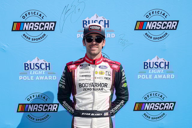 Ryan Blaney, driver of the #12 BodyArmor Zero Sugar Ford, poses for photos after winning the pole award during qualifying for the NASCAR Cup Series Ambetter Health 400 at Atlanta Motor Speedway on February 22, 2025 in Hampton, Georgia.