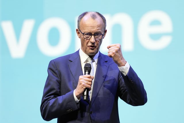 CDU top candidate for chancellor Friedrich Merz talks to supporters at the main election campaign event of the Christian Democratic Union ahead of the German federal Bundestag elections on Sunday, in Oberhausen, Germany, Friday, Feb. 21, 2025. (AP Photo/Martin Meissner)