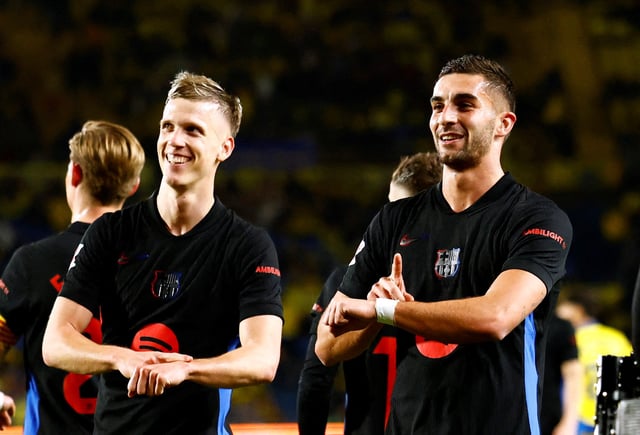 Soccer Football - LaLiga - Las Palmas v FC Barcelona - Estadio Gran Canaria, Las Palmas, Spain - February 22, 2025 FC Barcelona's Ferran Torres celebrates scoring their second goal with Dani Olmo REUTERS/Borja Suarez