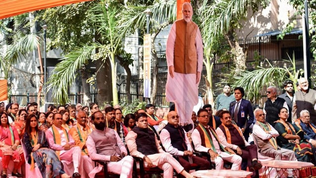 A gathering listening to the 119th edition of Prime Minister Narendra Modi's monthly radio program Mann Ki Baat, at Naraina Vihar on Sunday. (ANI)
