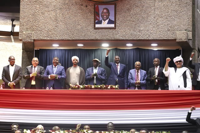 Representatives of Rapid Support Forces (RSF) sing during a planned signing ceremony of the Sudan Founding Charter aimed at establishing a unity government involving leaders of political forces, armed groups, and the Rapid Support Forces (RSF) at the Kenyatta International Convention Centre (KICC) in Nairobi, Tuesday, Feb. 18, 2025. (AP Photo/Andrew Kasuku)