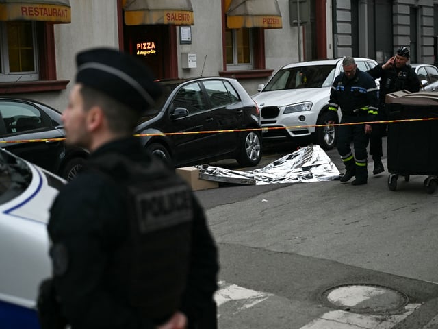 French municipal police officers operate to collect evidence at the site of a bladed weapon attack where a man is suspected of killing one person and wounding two municipal police officers in Mulhouse, eastern France on February 22, 2025. (Photo by SEBASTIEN BOZON / AFP) (Photo by SEBASTIEN BOZON/AFP via Getty Images)