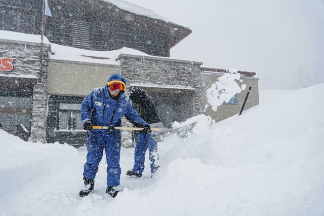 Workers shovel snow during a Feb. 13 storm at Mammoth Mountain in the Sierra Nevada. The storm dumped 6 feet of snow in 36 hours on the ski area. 