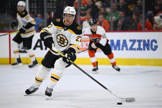 Nov 2, 2024; Philadelphia, Pennsylvania, USA; Boston Bruins defenseman Hampus Lindholm (27) controls the puck against the Philadelphia Flyers in the second period at Wells Fargo Center. Mandatory Credit: Kyle Ross-Imagn Images/File Photo