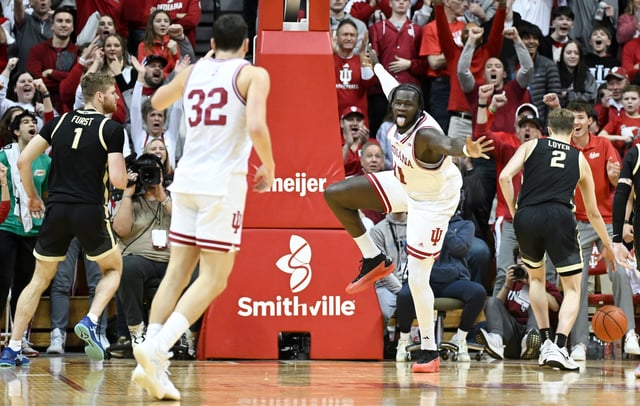 Feb 23, 2025; Bloomington, Indiana, USA; Indiana Hoosiers center Oumar Ballo (11) celebrates after a dunk during the second half against the Purdue Boilermakers at Simon Skjodt Assembly Hall. Mandatory Credit: Robert Goddin-Imagn Images