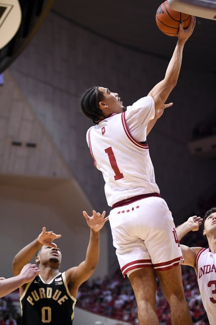 Feb 23, 2025; Bloomington, Indiana, USA; Indiana Hoosiers guard Myles Rice (1) scores past Purdue Boilermakers guard C.J. Cox (0) during the first half at Simon Skjodt Assembly Hall. Mandatory Credit: Robert Goddin-Imagn Images