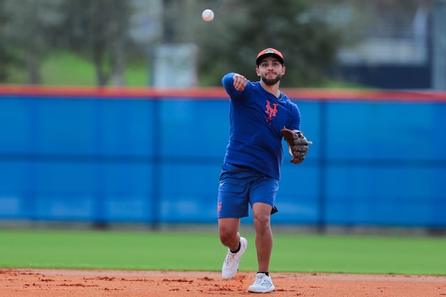 Feb 12, 2025; Port St. Lucie, FL, USA; New York Mets infielder Nick Madrigal (11) throws the baseball during Spring Training workouts at Clover Park. Mandatory Credit: Sam Navarro-Imagn Images/File Photo