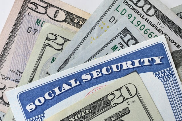 Stock image/file photo: A Social Security card with U.S. Dollars.