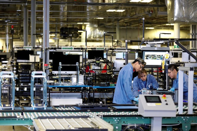 Flextronics International Apple factory employees work on Apple Mac Pro computer assembly in Austin, TX, U.S., November 20, 2019.