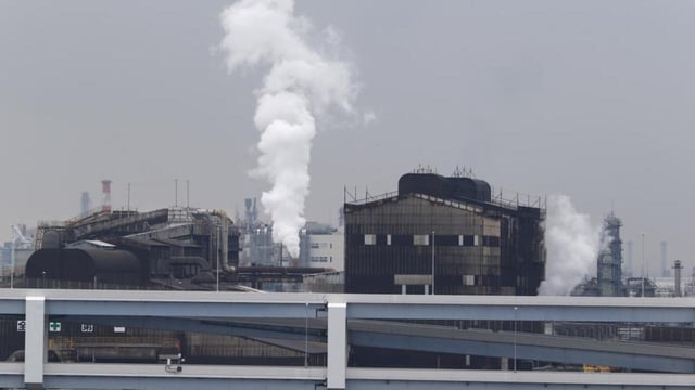 Smoke billows from an oil refinery in Kawasaki, southwest of Tokyo. (AP)