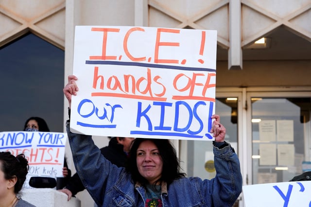 Protesters opposing possible Immigration and Customs Enforcement (ICE) raids in public schools demonstrate on the steps of the State Department of Education during their monthly board meeting in Oklahoma City, Oklahoma on Jan. 28, 2025.