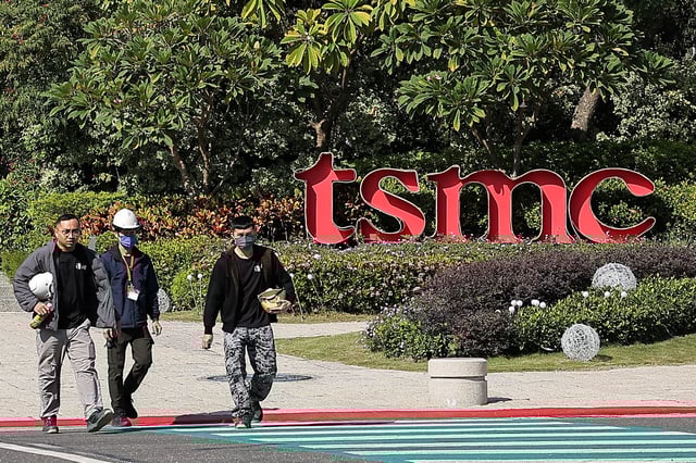 People walk across the streets in front of TSMC Fab 18 at Southern Taiwan Science Park in Tainan, Taiwan December 5, 2024. REUTERS/Ann Wang/File Photo