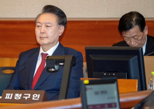 South Korea's impeached President Yoon Suk Yeol attends the hearing of his impeachment trial over his short-lived imposition of martial law, at the Constitutional Court in Seoul, South Korea, February 20, 2025. SONG KYUNG-SEOK/Pool via REUTERS/File Photo
