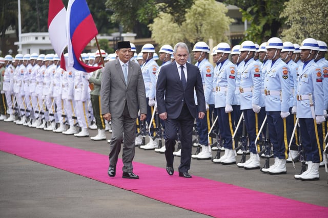 Russian Security Council Secretary Sergei Shoigu, right, and Indonesian Defense Minister Sjafrie Sjamsoeddin inspect honor guards during a welcoming ceremony prior to their meeting in Jakarta, Indonesia, Tuesday, Feb. 25, 2025. (AP Photo/Tatan Syuflana)