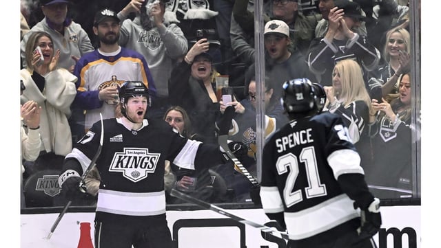 Kings left wing Warren Foegele, left, celebrates with defenseman Jordan Spence after scoring the go-ahead goal during the third period of their game against the Vegas Golden Knights on Monday night at Crypto.com Arena. The Kings scored four goals in the third to rally for a 5-2 win. (AP Photo/Alex Gallardo)