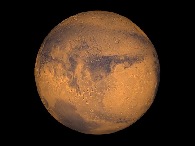 The planet Mars is seen in an undated NASA image. We now know that the red color is because of iron minerals in the soil rusting, likely ferrihydrite.