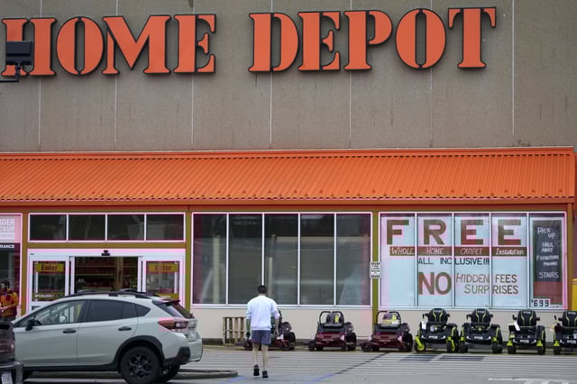 FILE - Lawnmowers are lined up on display outside a Home Depot store in Uniontown, Pa. on Saturday, March 2, 2024. (AP Photo/Gene J. Puskar, File)
