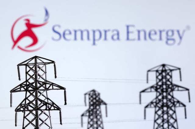 Electric power transmission pylon miniatures and Sempra Energy logo are seen in this illustration taken, December 9, 2022. REUTERS/Dado Ruvic/Illustration/File Photo