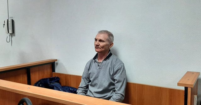 Russian citizen Alexei Moskalyov, who is accused of discrediting the country's armed forces in the course of Russia-Ukraine military conflict, attends a court hearing in the town of Yefremov in the Tula region, Russia, March 27, 2023. SOTA/Handout via REUTERS 
