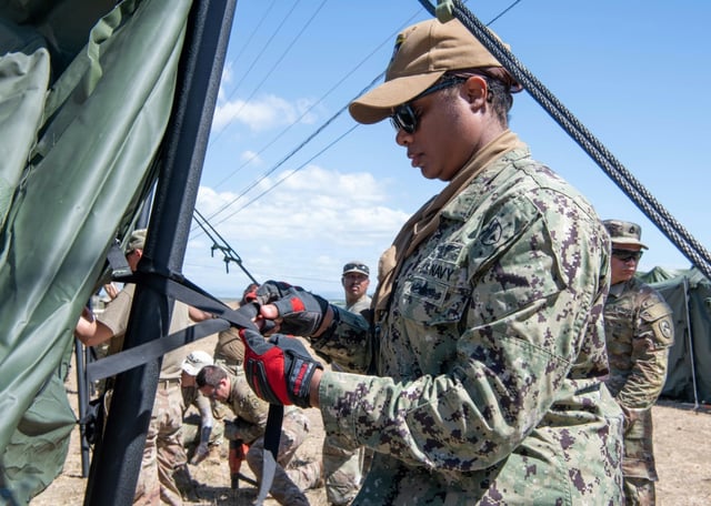 An image obtained from the US Department of Defense shows American service members setting up tents at Guantanamo in Cuba on February 9, 2025 as part of the mission to expand the base's capacity to hold detained migrants