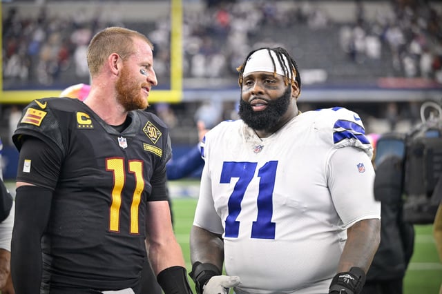 Oct 2, 2022; Arlington, Texas, USA; Washington Commanders quarterback Carson Wentz (11) talks with Dallas Cowboys offensive tackle Jason Peters (71) after the game at AT&T Stadium. Mandatory Credit: Jerome Miron-USA TODAY Sports/File Photo