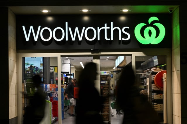 People walk past a Woolworths supermarket in the Sydney Central Business District in Sydney, Australia, May 14, 2024. REUTERS/Jaimi Joy/File Photo