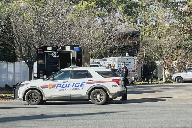 Nassau County (N.Y.) police respond to a crime scene Woodbury, N.Y.
