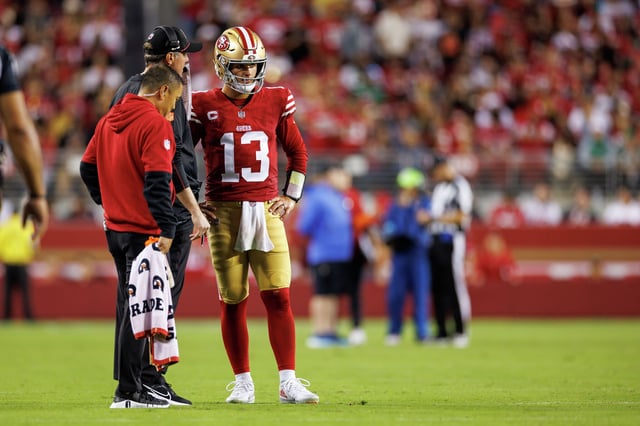 Quarterback Brock Purdy of the San Francisco 49ers talks with quarterbacks coach Brian Griese during the fourth quarter of an NFL game against the New York Jets at Levi’s Stadium in Santa, Calif., on Sept. 9, 2024. 