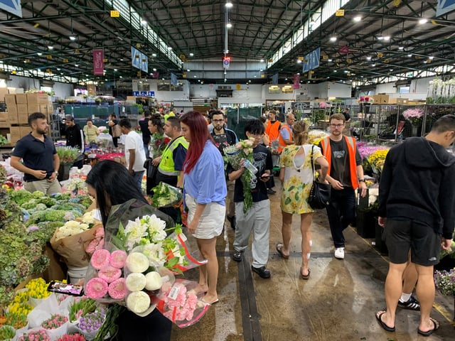 Customers shop at the Sydney Flower Market in preparation for Valentine's Day in Sydney, Australia, February 13, 2025. REUTERS/Stefica Nicol Bikes/File photo