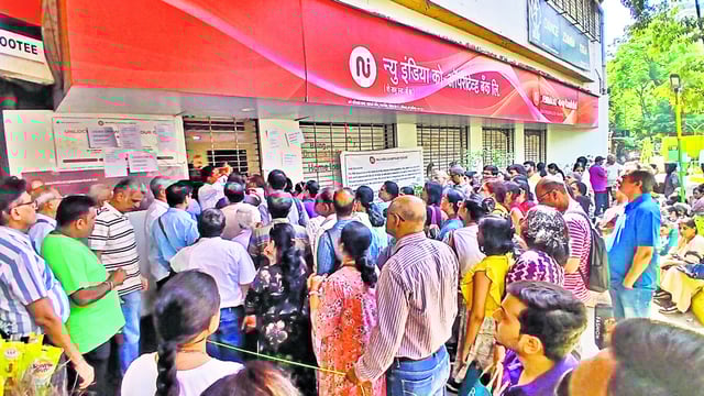 Thane, India - February 15, 2025: New India cooperative bank account holders are seen outside the bank, after the RBI imposed restrictions, India, on Saturday, February 15, 2024. (Praful Gangurde /HT Photo)