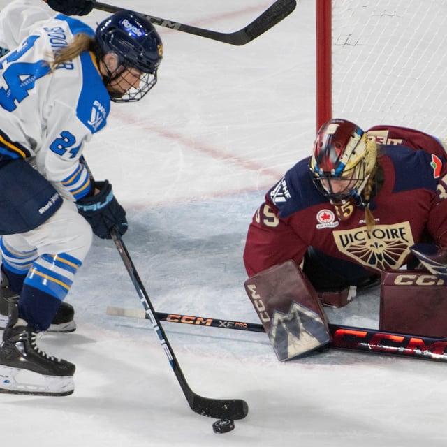 Toronto Sceptres' Natalie Spooner (24) takes the puck in close to Montreal Victoire goalie Ann-Renee Desbiens (35) during third period PWHL hockey action in Lavalc Que. on Tuesday, Feb. 25, 2025. THE CANADIAN PRESS/Peter McCabe