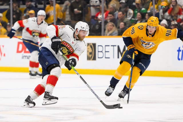 Feb 25, 2025; Nashville, Tennessee, USA;  Florida Panthers center Sam Bennett (9) takes a shot on goal against the Nashville Predators during the second period at Bridgestone Arena. Mandatory Credit: Steve Roberts-Imagn Images
