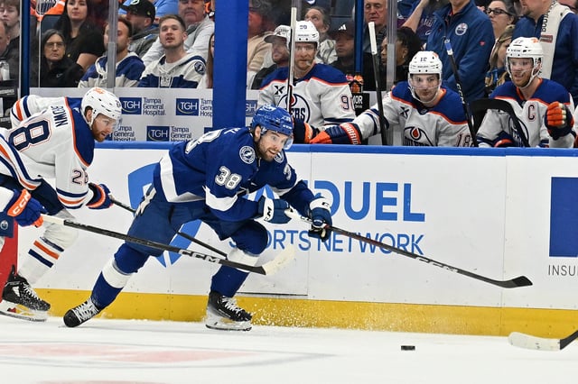 Feb 25, 2025; Tampa, Florida, USA ; Tampa Bay Lightning left wing Brandon Hagel (38) chases down the puck in the first period against the Edmonton Oilers  at Amalie Arena. Mandatory Credit: Jonathan Dyer-Imagn Images