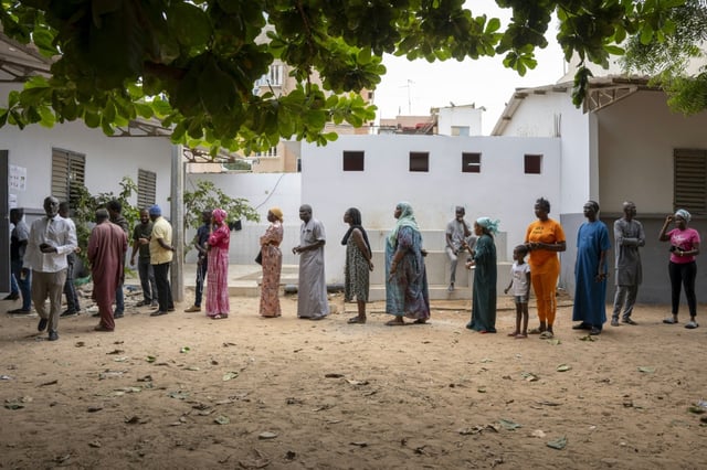 Senegalese voters wait outside a polling station in Dakar in November 2024