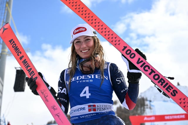 Mikaela Shiffrin, winner, poses with skis marking her "100 Victories" after the podium ceremony of the Women's Slalom event during the FIS Alpine Skiing World Cup in Sestriere, Italy, on February 23, 2025.