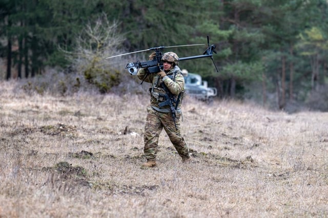 An Anduril Ghost X drone is carried by an US soldier at the Hohenfels Training Area in southern Germany (Photo: Armin Weigel/ AFP)