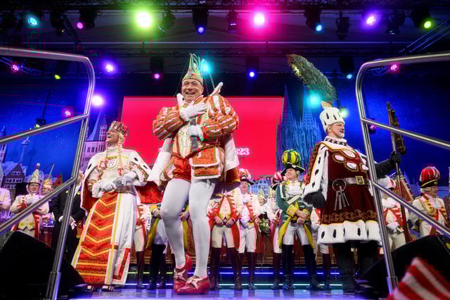 Members of the Cologne Dreigestirn Hendrik Ermen as Maiden (Jungfrau),  Rene Kloever as Prince, and Michael Samm as Peasant (Bauer) perform at a Carnival session, in Cologne, Germany February 13, 2025. REUTERS/Jana Rodenbusch/File Photo
