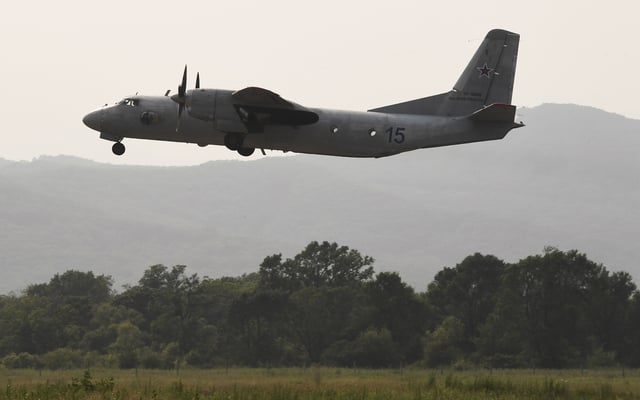 FILE - An Antonov An-26 military transport aircraft takes off during training flights at the Nikolaevka aviation garrison of the Russia&#39;s Pacific naval fleet in Primorye Territory, Russia.