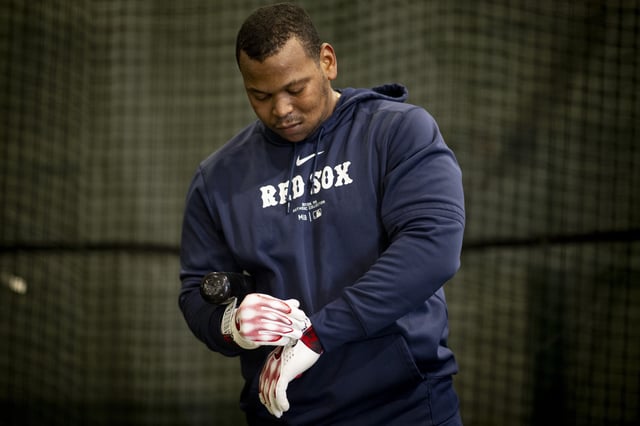 FORT MYERS, FLORIDA - FEBRUARY 15: Rafael Devers #11 of the Boston Red Sox hits in the batting cages during a Spring Training workout at JetBlue Park at Fenway South in Fort Myers, Florida on February 15, 2025.