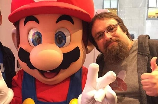 Grant Kirkhope and Davide Soliani pose with Mario.