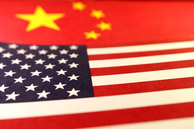 U.S. and Chinese flags are seen in this illustration taken January 8, 2025. REUTERS/Dado Ruvic/Illustration/File Photo