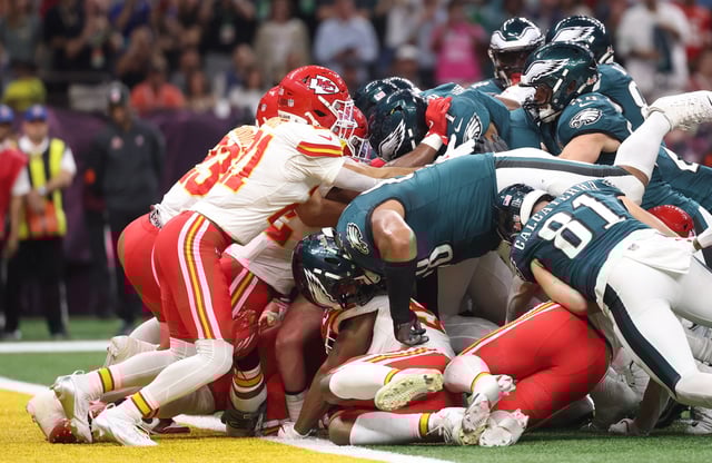 Feb 9, 2025; New Orleans, LA, USA; Philadelphia Eagles quarterback Jalen Hurts (1) scores a touchdown against the Kansas City Chiefs in the first quarter in Super Bowl LIX at Ceasars Superdome. Mandatory Credit: Mark J. Rebilas-Imagn Images/File Photo